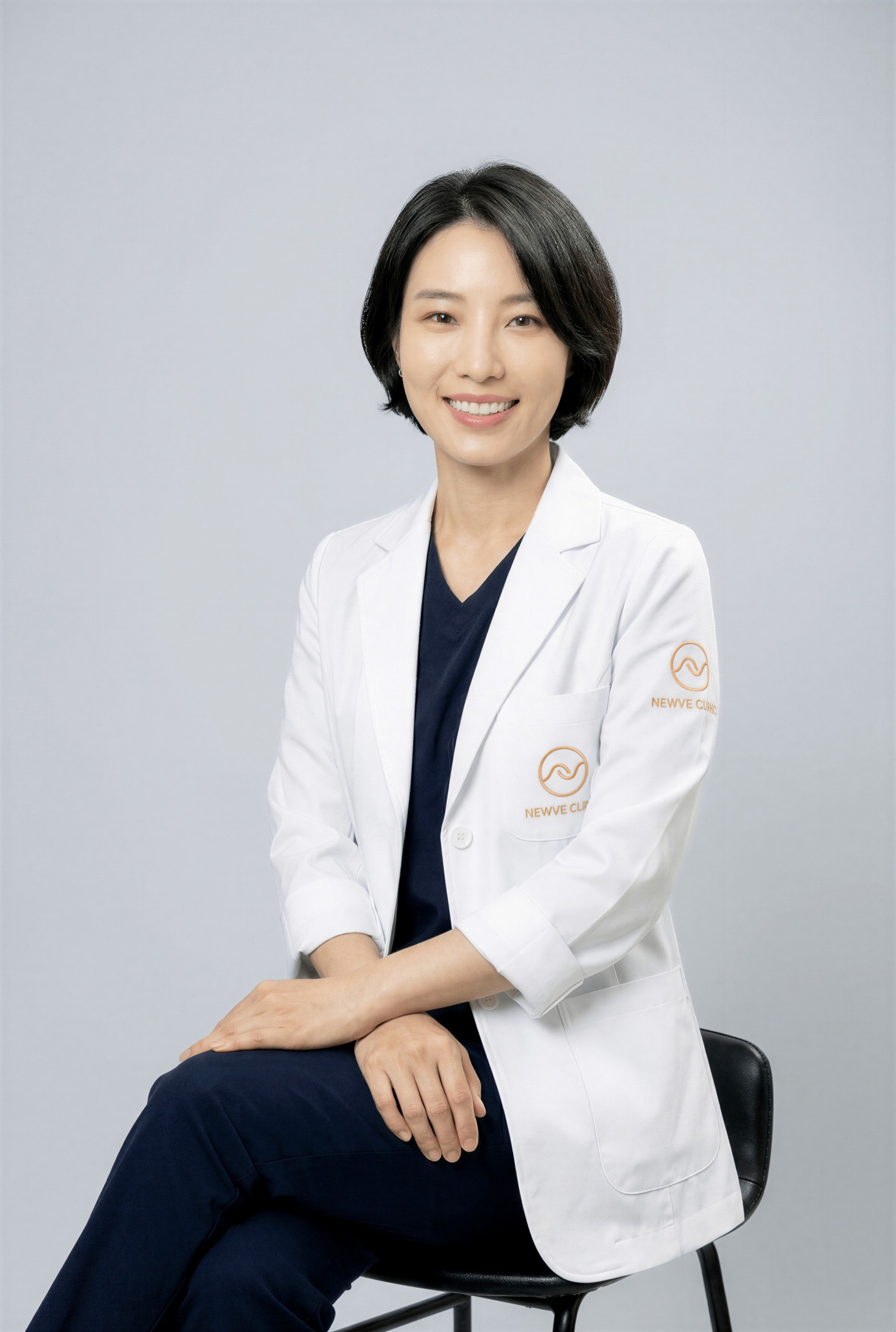 Dr. Hyunhwa Kim seated smile